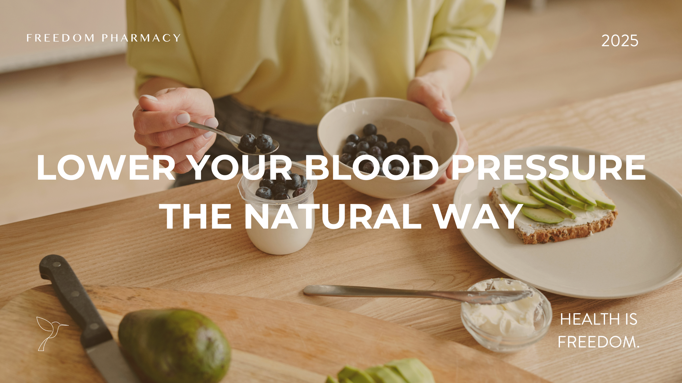 A person in a light green shirt preparing a healthy meal with blueberries, yogurt, and avocado toast on a wooden table. The text overlay reads, "Reduce high blood pressure naturally," with "Freedom Pharmacy" and the tagline "Health is Freedom" in the corners.