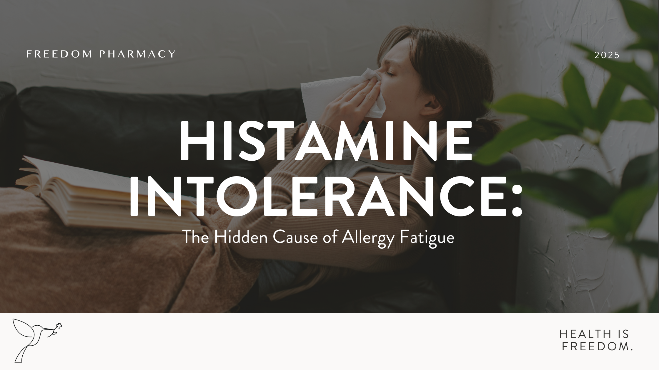 A woman sits on a couch wrapped in a blanket, holding a tissue to her nose, likely experiencing allergy symptoms. An open book rests beside her, and a green plant is visible in the foreground. The overlay text reads, "Histamine Intolerance: The Hidden Cause of Allergy Fatigue," with Freedom Pharmacy branding and the tagline "Health is Freedom."